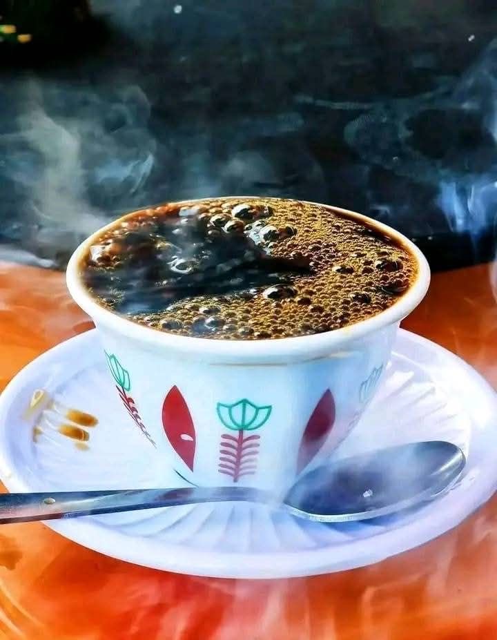 Pouring coffee from jebena